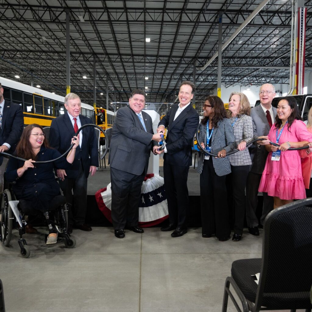 Joliet Grand Opening with a group of people